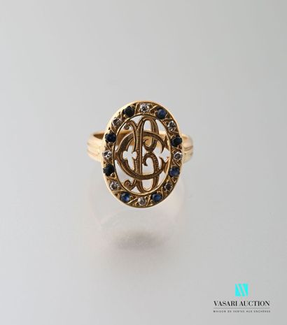 null Ring in 750 thousandths yellow gold, oval openwork motif with BC numerals surrounded...