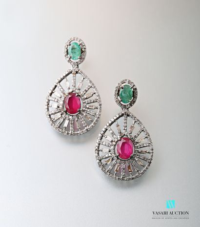 null Pair of openwork piriform silver earrings centered with an oval cut ruby in...