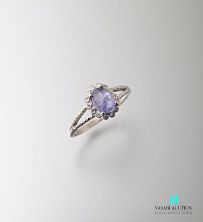 null 925 sterling silver ring set with a tanzanite cabochon surrounded and shouldered...