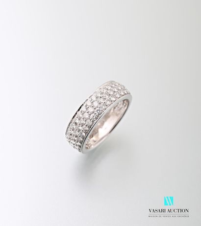 null A 750 thousandth white gold band ring set with three lines of brilliants of...