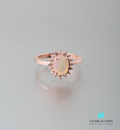 null Pink vermeil ring 925 thousandth set with a central opal surrounded by white...