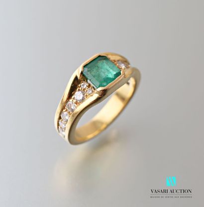 null 750 thousandths yellow gold ring set with a central square-cut emerald with...