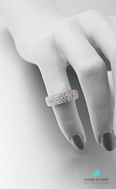 null A 750 thousandth white gold band ring set with three lines of brilliants of...