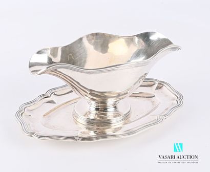 null Sauceboat and its frame in 950-thousandths sterling silver, with a border of...