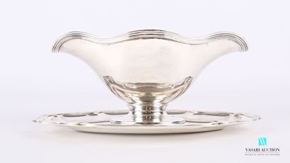 null Sauceboat and its frame in 950-thousandths sterling silver, with a border of...