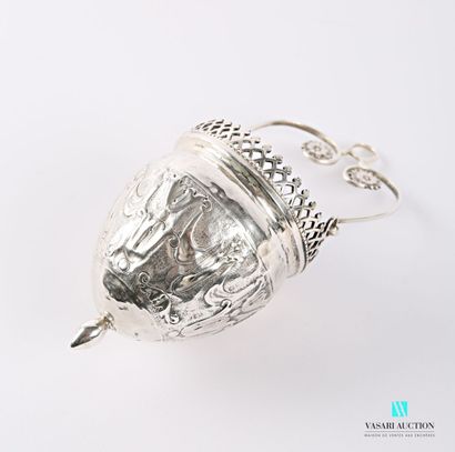 null A silver nightlight, the ovoid body decorated with corolla leaves alternating...