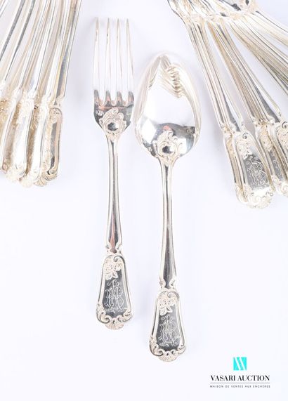 null A suite of eleven pieces of cutlery and a silver table spoon, the handle adorned...