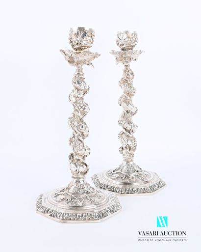 null Pair of silvered bronze candleholders, it has an octagonal base hemmed with...