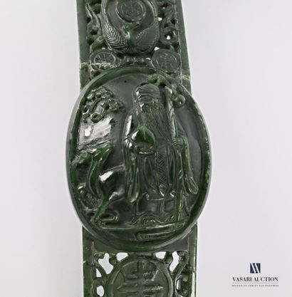 null CHINE

Scèptre de forme mouvementé en pierre dure verte à décor d'un motif calligraphique...