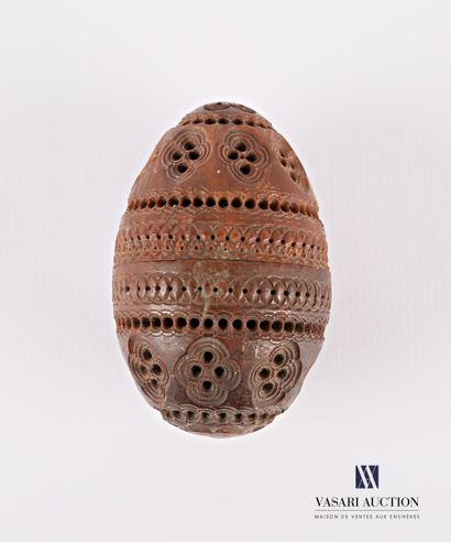 null Rosary case in corozo nut carved in an ovoid shape, the body carved and pierced...