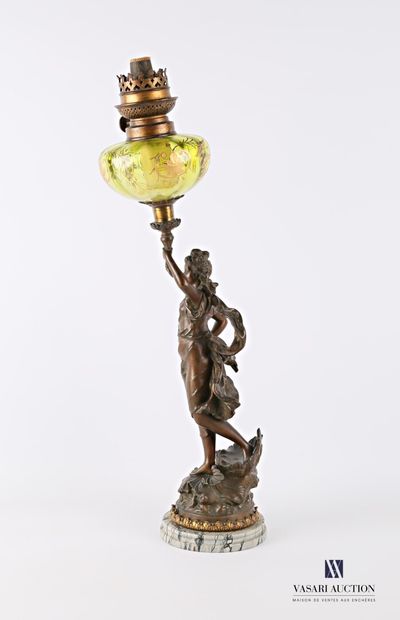 null Oil lamp resting on a grey veined marble base, the shaft in ruler with brown...