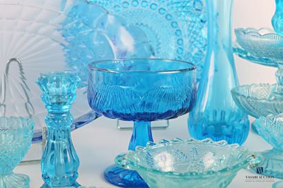 null Set in blue tinted moulded glass comprising an oval tray decorated with gadroons...