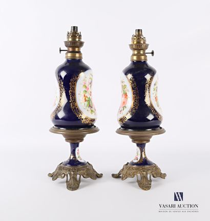 null Pair of metal and porcelain kerosene lamps with polychrome decoration and gilded...