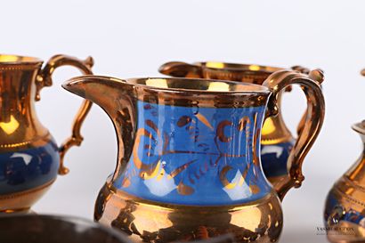 null JERSEY

Copper-glazed earthenware set with blue bands, some with stylised foliage...