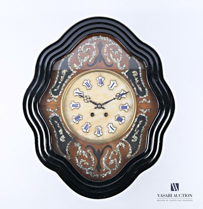 null Ox-eye clock in black lacquered wood, the round dial shows the hours in Roman...