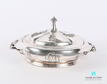 null A round silver-plated metal vegetable dish, the belly is crumpled and flanked...
