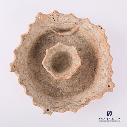 null Terracotta ? candleholder in a round shape, the crenellated rim and the basin...