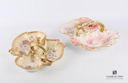 null Two eventfully shaped condiment dishes decorated with polychrome-treated flowers...