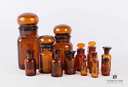 null Set of thirteen different models of brown tinted moulded glass apothecary jars...
