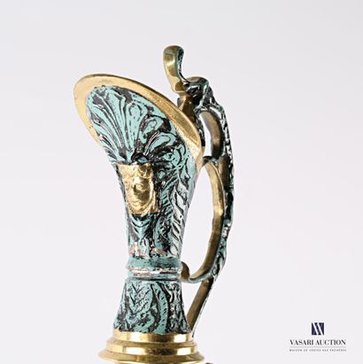 null Ewer and its bronze selette with a teal blue patina, decorated in relief with...