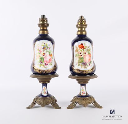 null Pair of metal and porcelain kerosene lamps with polychrome decoration and gilded...