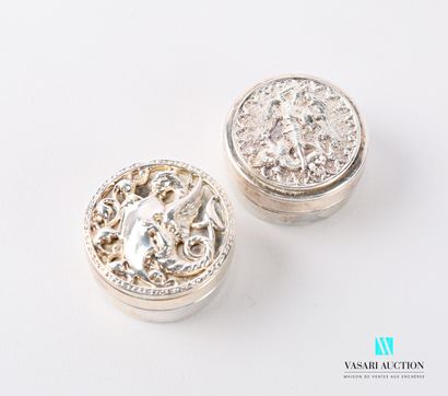 null Set of two round pill boxes in silver metal, the lids showing one Saint George...
