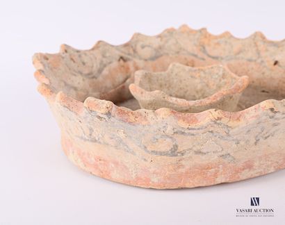 null Terracotta ? candleholder in a round shape, the crenellated rim and the basin...