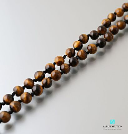 null Necklace decorated with tiger eye beads, the clasp snap hook in metal

Length:...