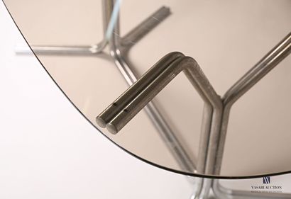 null Dining room table, the oblong smoked glass top rests on two tubular chrome-plated...