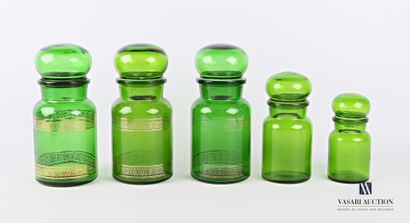 null A suite of five apothecary jars in green tinted glass, the ball stoppers decorated...