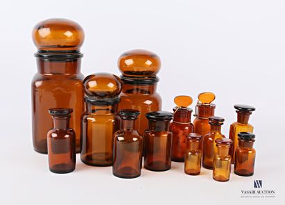 null Set of thirteen different models of brown tinted moulded glass apothecary jars...