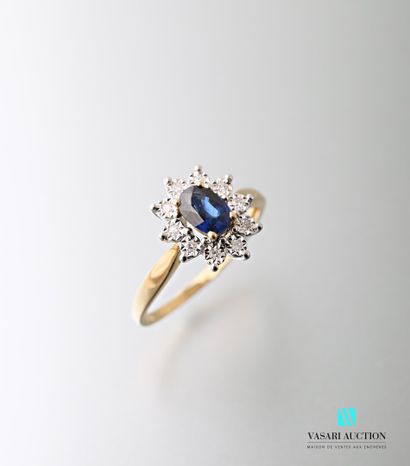 null White and yellow gold 750 thousandths ring set with a sapphire calibrating 0.68...