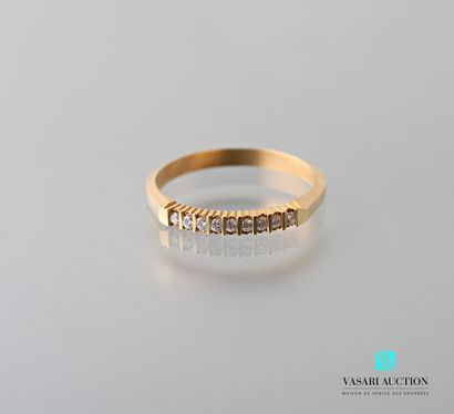 null Half wedding band in 750 thousandths yellow gold set with nine brilliant-cut...