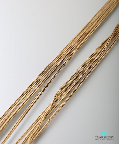 null Long necklace in yellow gold 750 thousandths braided broken mesh 

Gross weight...