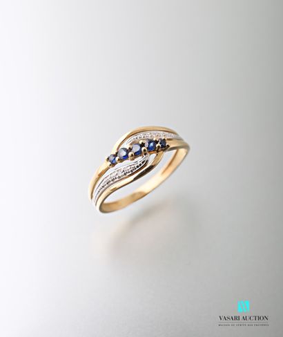 null 750-thousandths white and yellow gold ring with an openworked, animated body...