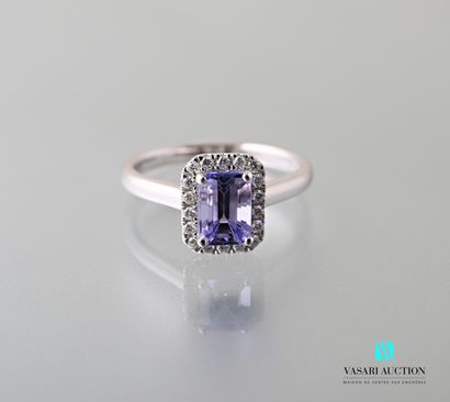 null 750 thousandths white gold ring set with a GRS-certified emerald-sized tanzanite...