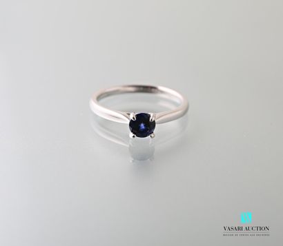 null 750 thousandths white gold ring set with a round sapphire calibrating approximately...