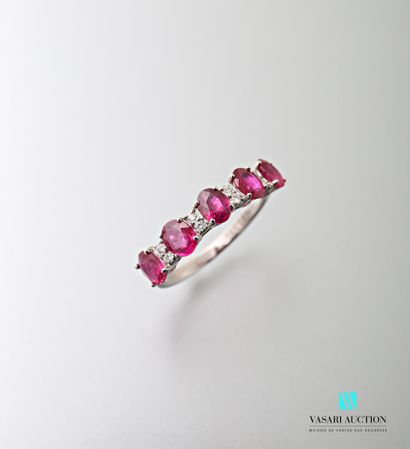 null 750 thousandths white gold ring set with five oval-cut rubies interspersed with...