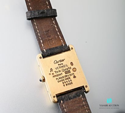 null Cartier, men's wristwatch, Tank model in 925 thousandths vermeil, the dial in...