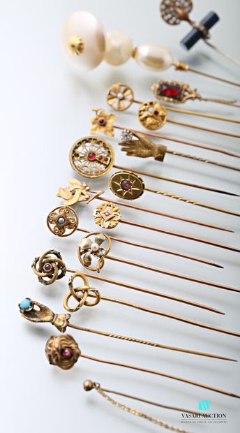 null Sixteen 19th and early 20th century gilded metal pins decorated with imitation...
