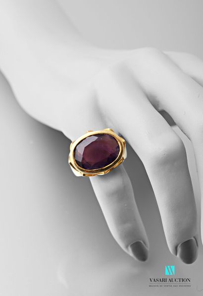 null Vermilion ring set with an amethyst of oval size in a closed setting.

Gross...