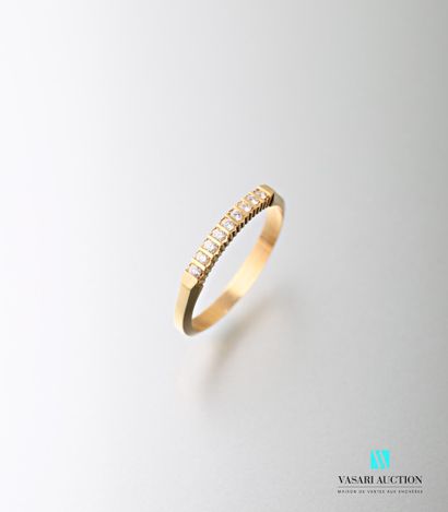 null Half wedding band in 750 thousandths yellow gold set with nine brilliant-cut...