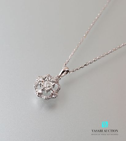 null A 750 thousandth white gold openwork pendant and chain, the openwork pendant...