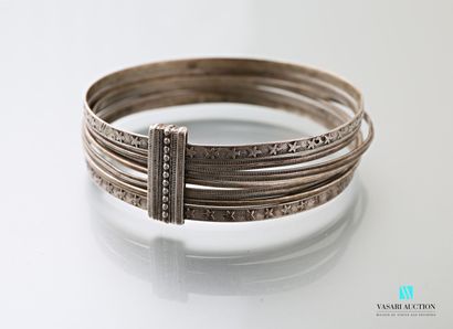 null A silver week book with a guilloche or star decoration, the seven bracelets...