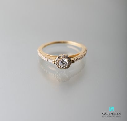 null 750 thousandths yellow gold ring set with a brilliant cut diamond calibrating...