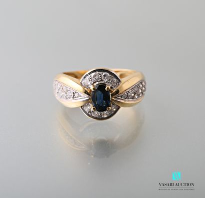 null 750-thousandths yellow gold ring set with an oval-shaped sapphire calibrating...