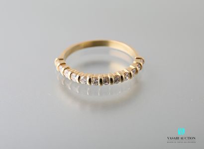 null Half wedding band in 750 thousandths yellow gold set with twelve brilliants...
