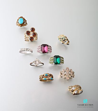 null Ten fancy gold or silver metal rings set with imitation stones.