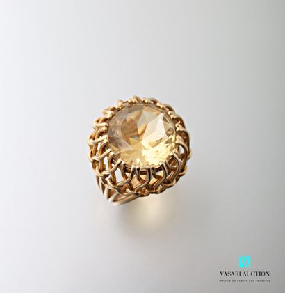 null Yellow gold ring 750 thousandths: gold threads holding a round faceted central...
