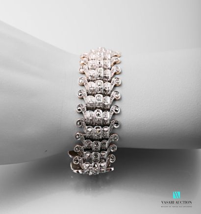 null Art Deco silver cuff bracelet paved with white stones, the mesh bridge and decorated...